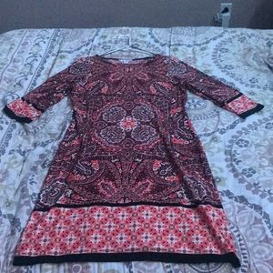 An orange and black silky dress💞